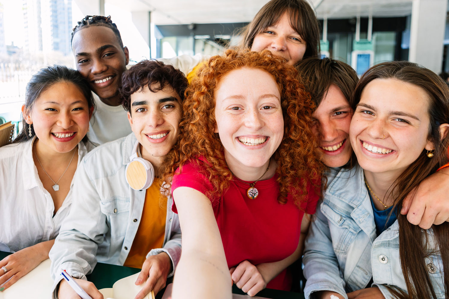 A group of people that are smiling for the camera
